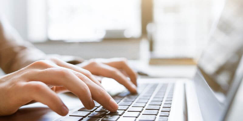 website copywriting concept typing on keyboard website copywriting concept typing on keyboard
